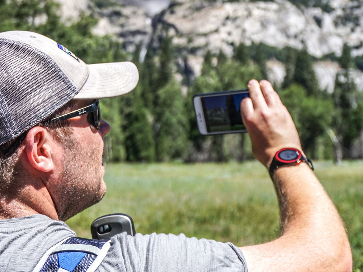 Hiker taking an image at Yosemite Valley in Yosemite National Park