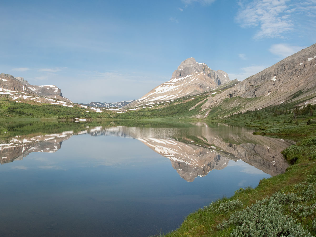 Mountain reflection on Baker Lake and the Skoki Region backpacking trail in Banff National Park