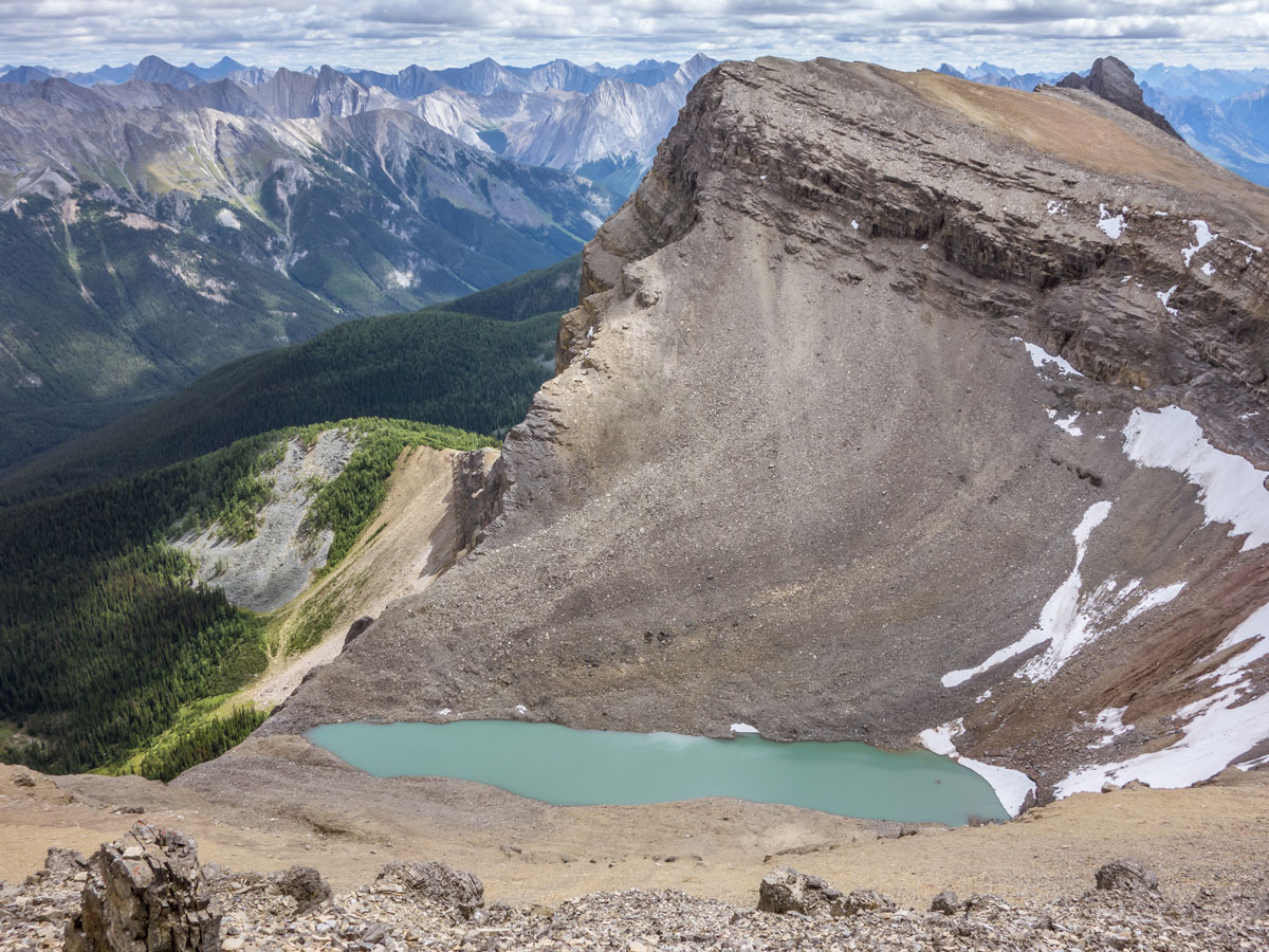 A small hidden lake on Helena Ridge scramble in Banff National Park