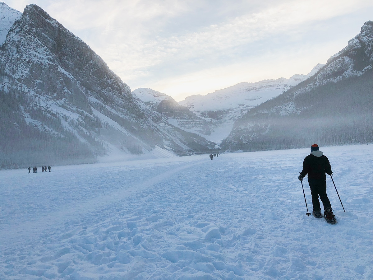 People on Lake Louise snowshoe trail in Banff National Park