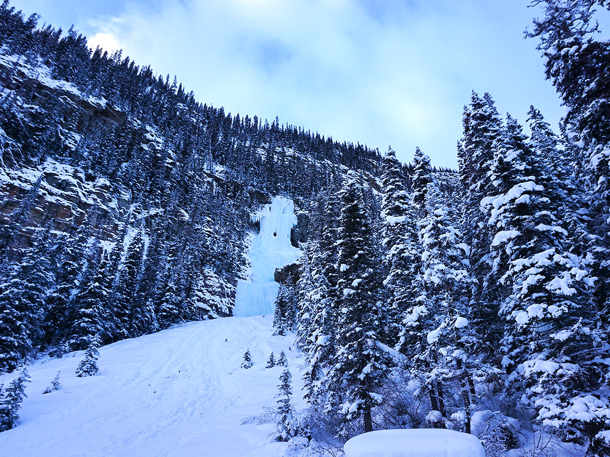 Ice climbers on Lake Louise snowshoe trail in Banff National Park