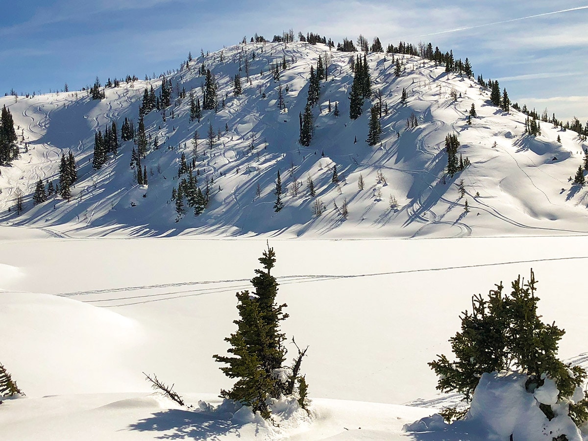 Winter views of Rock Isle Lake on Sunshine Meadows snowshoe trail Banff National Park