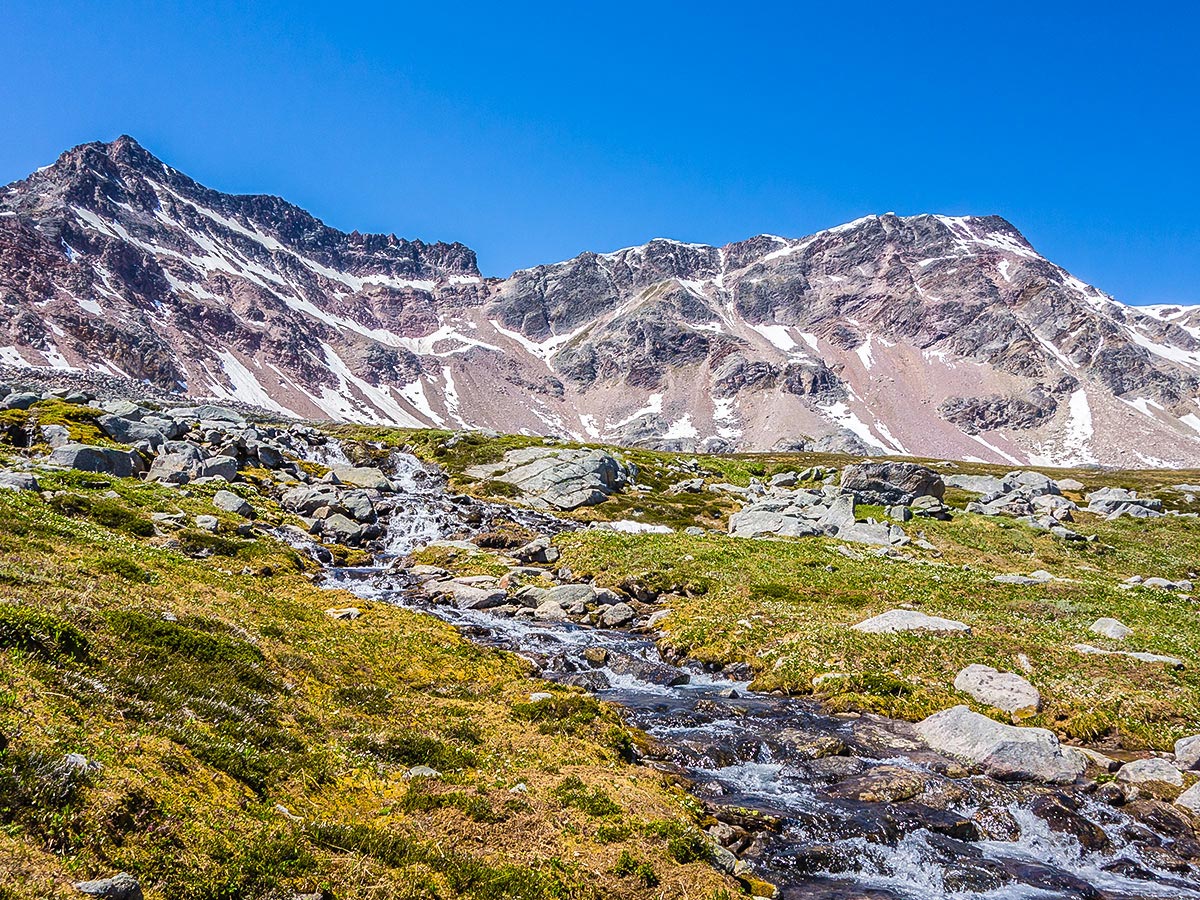 Waterfall flowing out of the Upper Lakes on Maligne Pass and Replica Peak backpacking trail in Jasper National Park