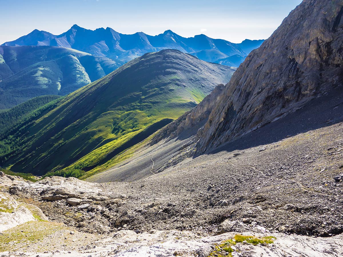 View down to the Grassy Pass on Mist Mountain scramble in Kananaskis near Canmore, the Canadian Rockies