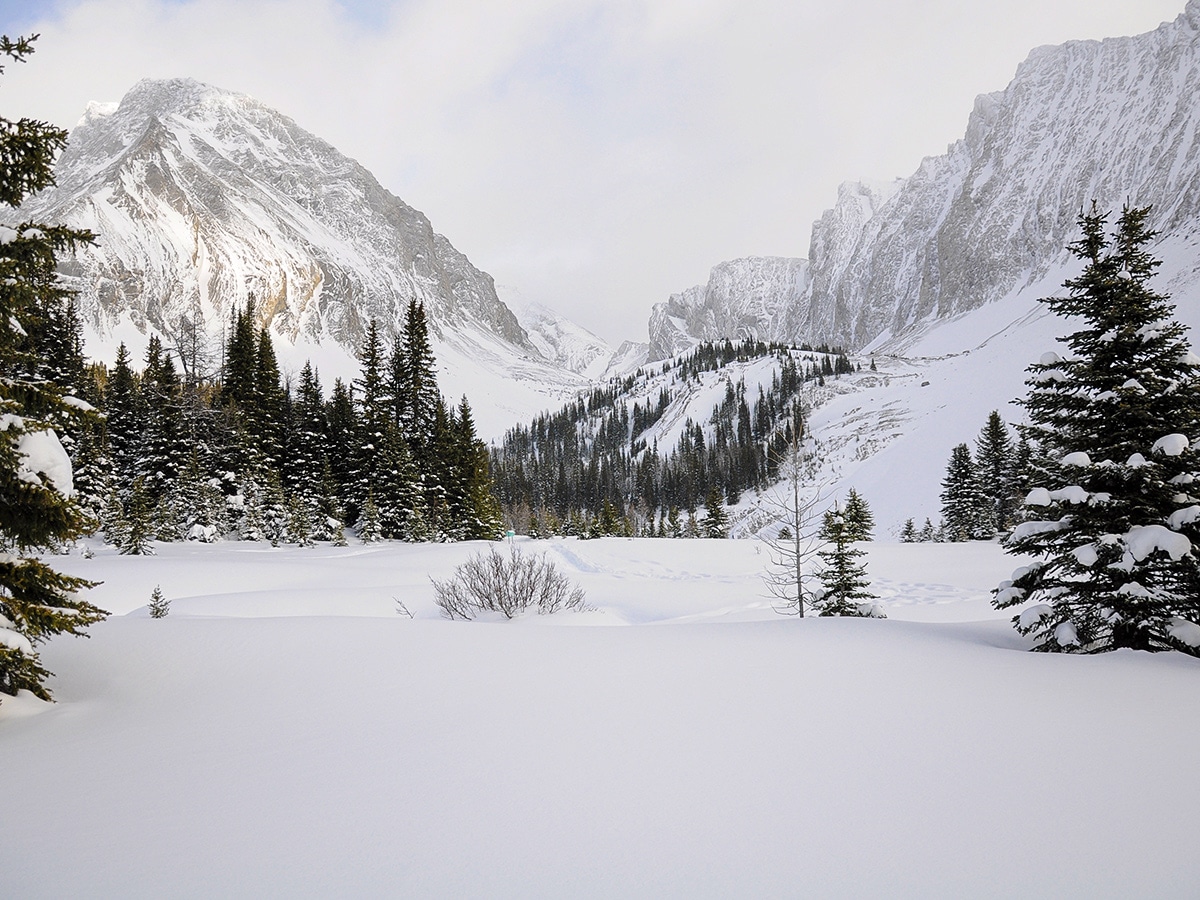 Frozen lake on Chester Lake snowshoe trail in Kananaskis near Canmore