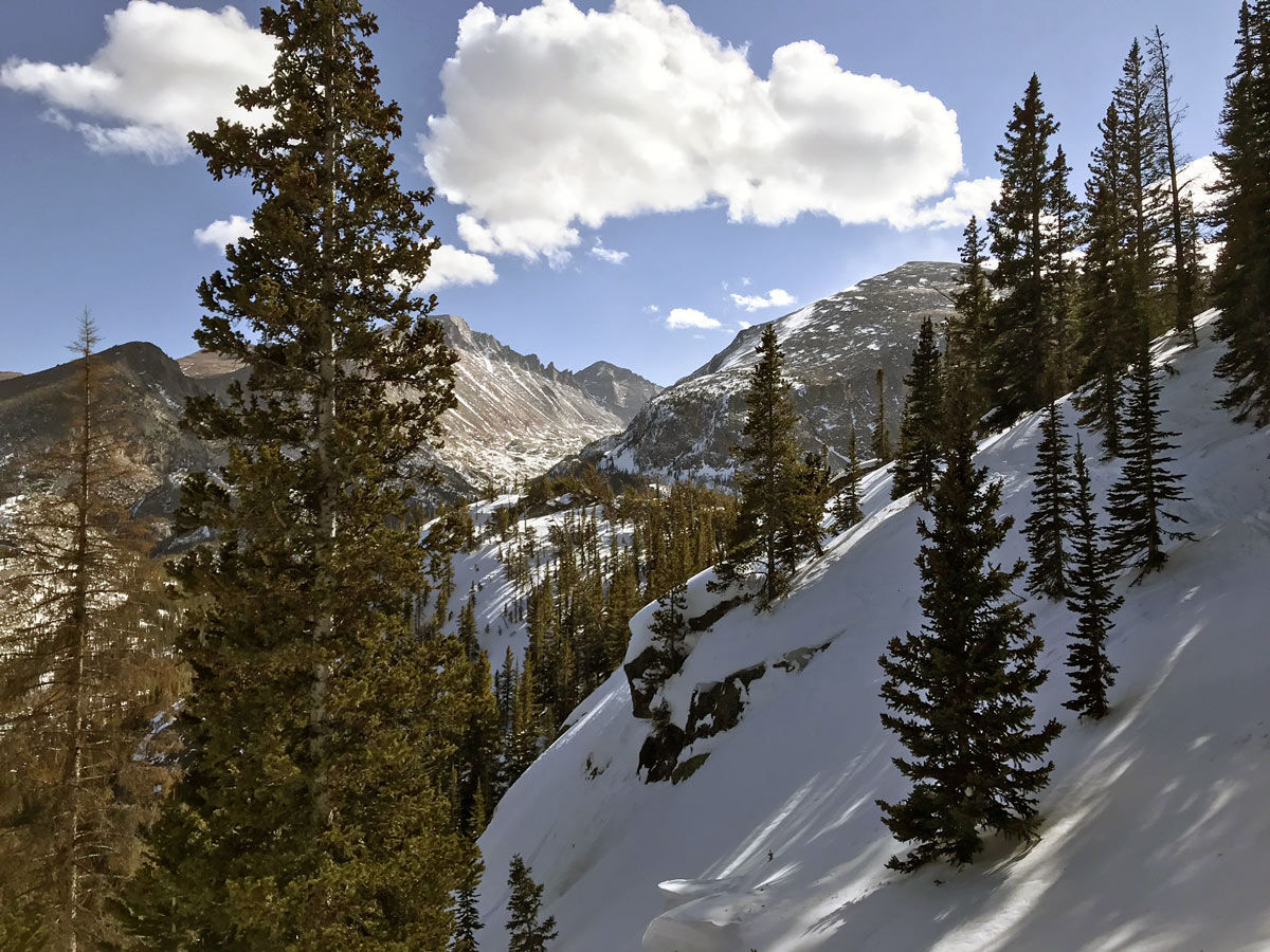 Hiking on Lake Haiyaha snowshoe trail in Rocky Mountain National Park, Colorado