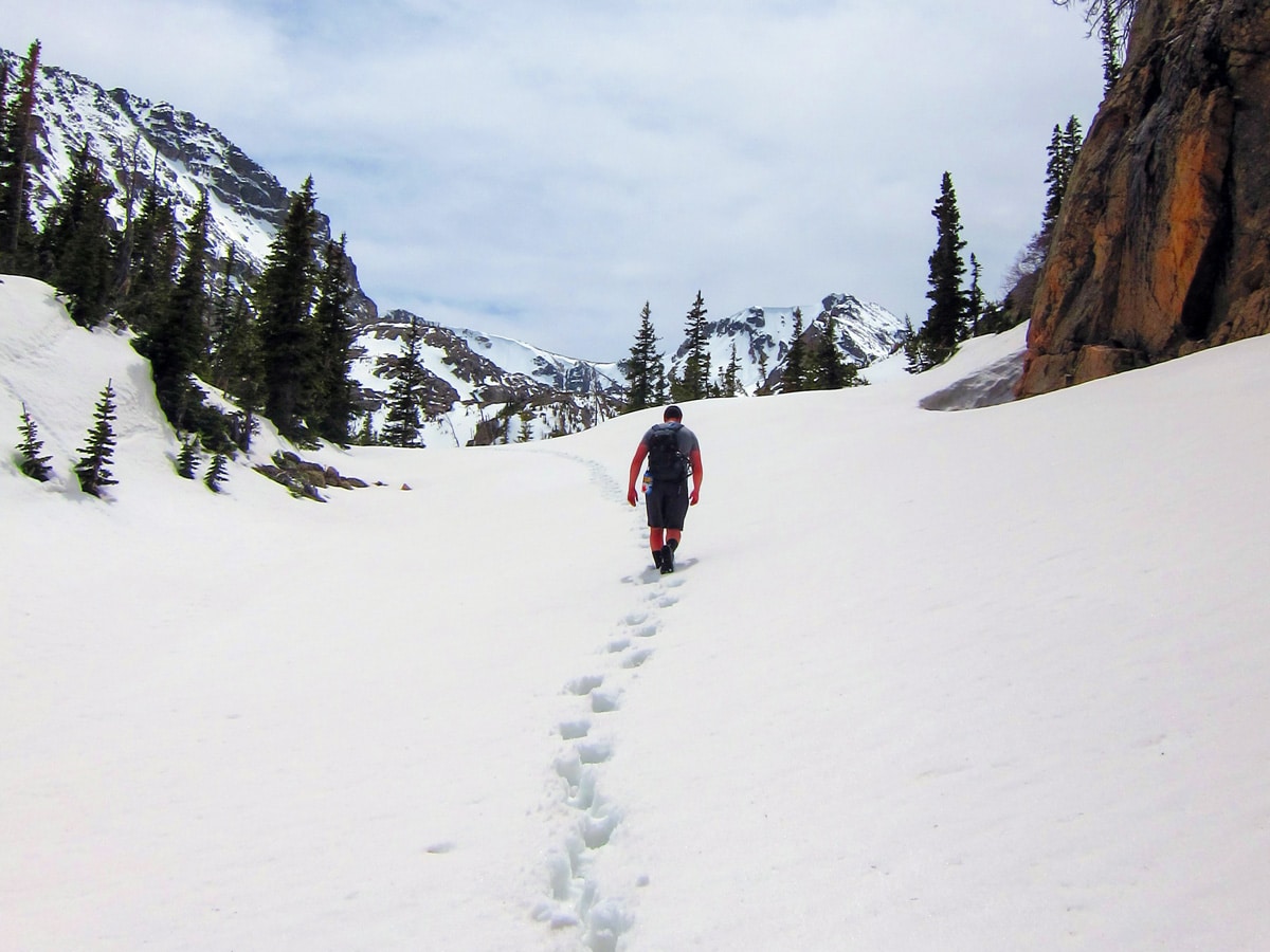 Hiking on Ouzel Lake snowshoe trail in Rocky Mountain National Park, Colorado