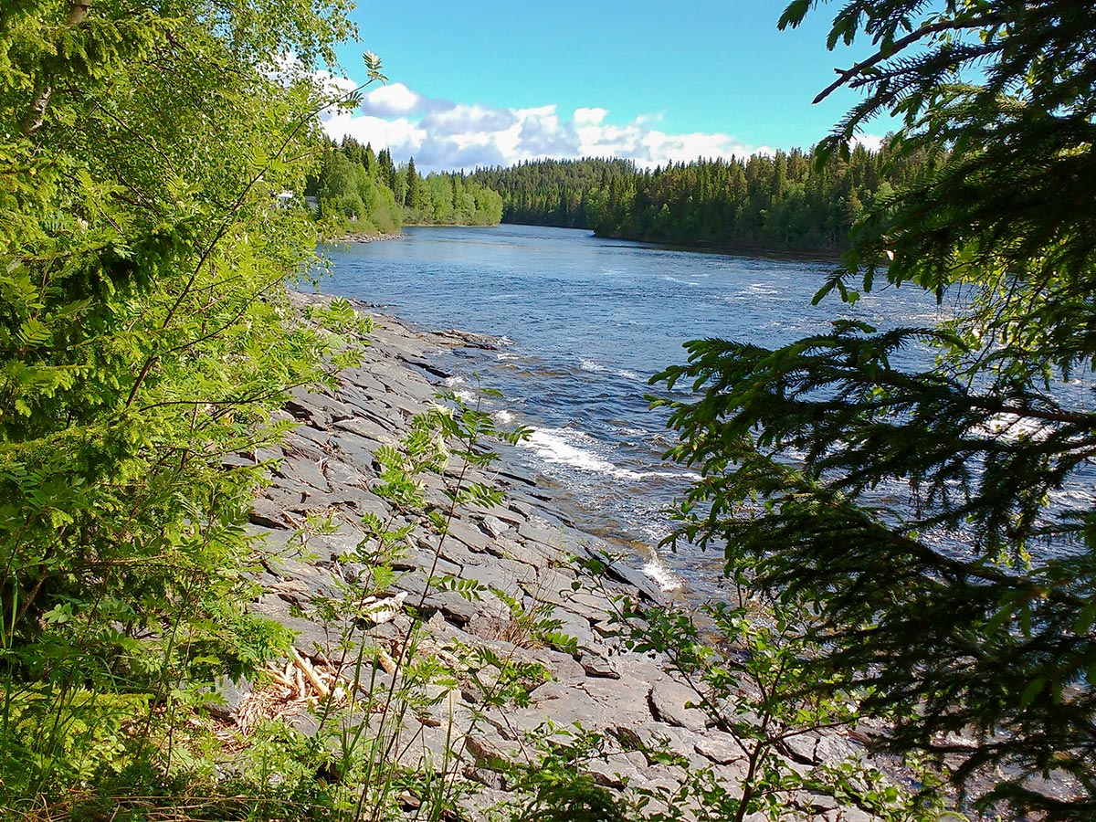 River with historical flagstones on Ristafallsrundan hike in Åre, Sweden