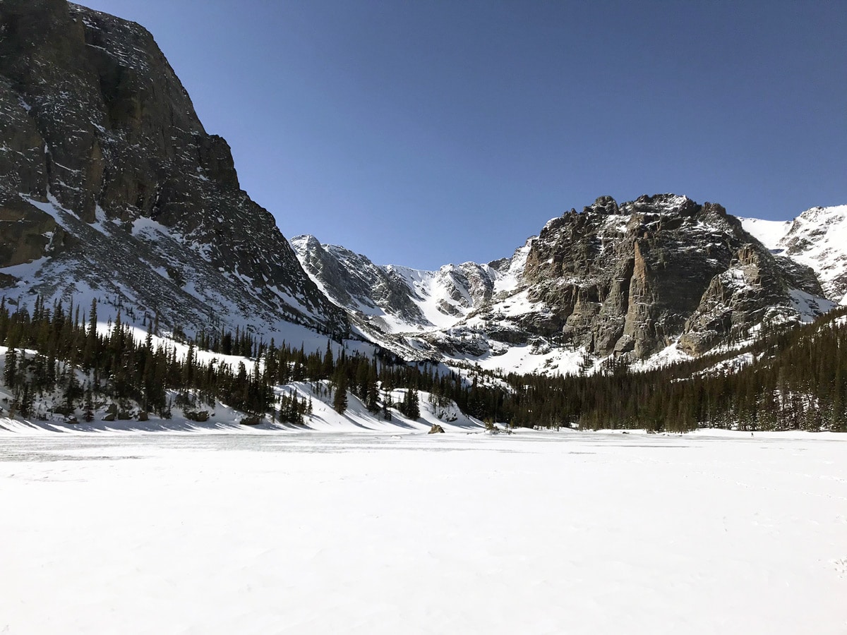 Frozen Lake on The Loch snowshoe trail in Rocky Mountain National Park, Colorado