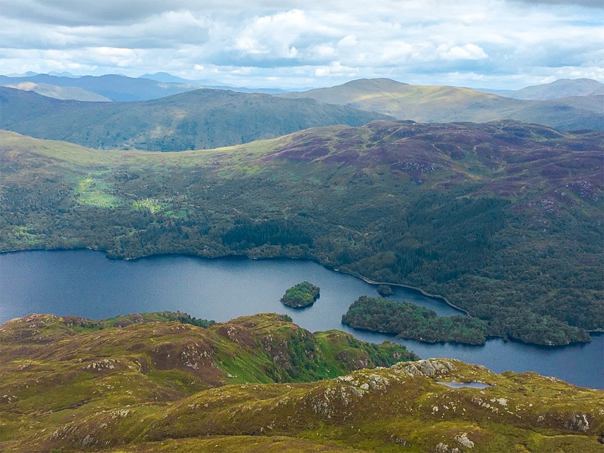 Loch Katrine view from Ben Venue summit on Ben Venue hike in Loch Lomond and The Trossachs region in Scotland