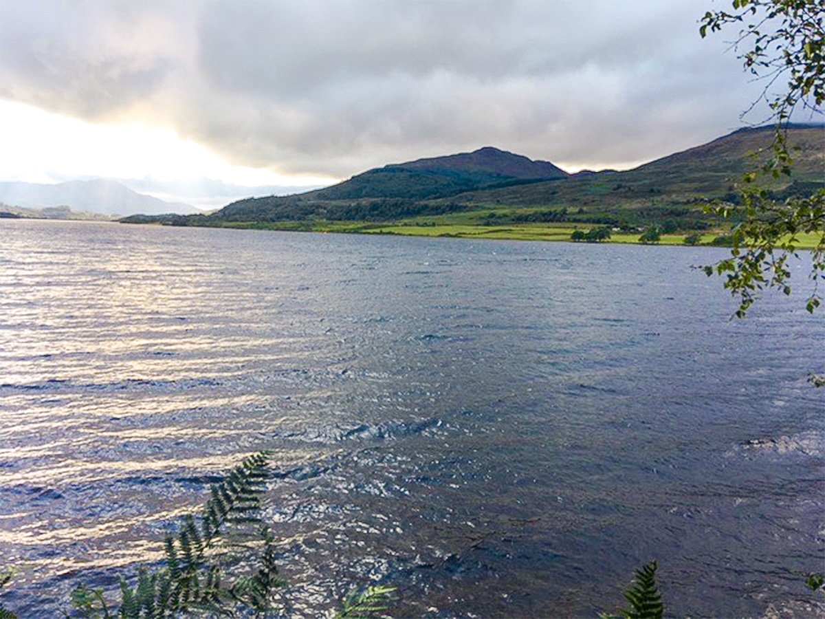 Beautiful walk along the shore on Loch Venachar hike in Loch Lomond and The Trossachs region in Scotland