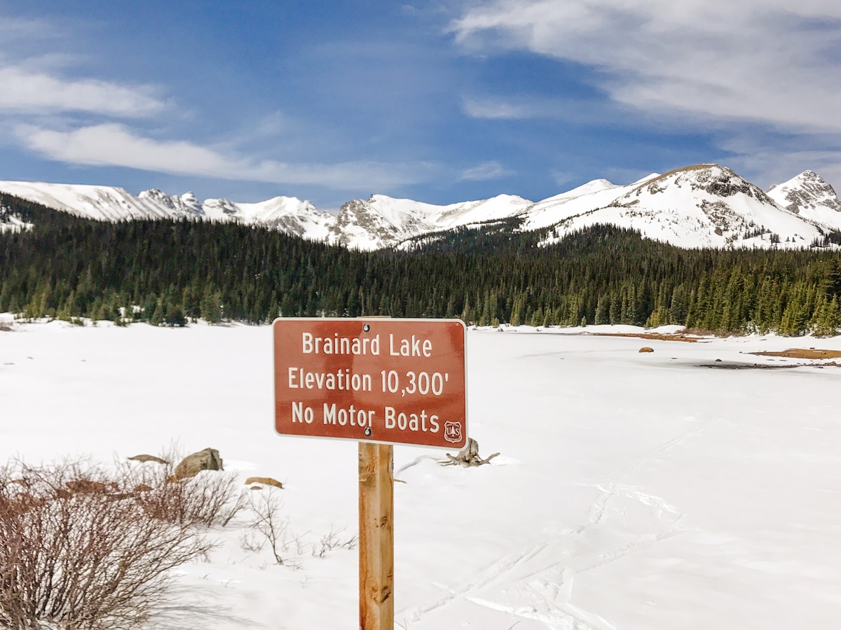 Sign of the lake on Brainard Lake snowshoe trail in Indian Peaks, Colorado