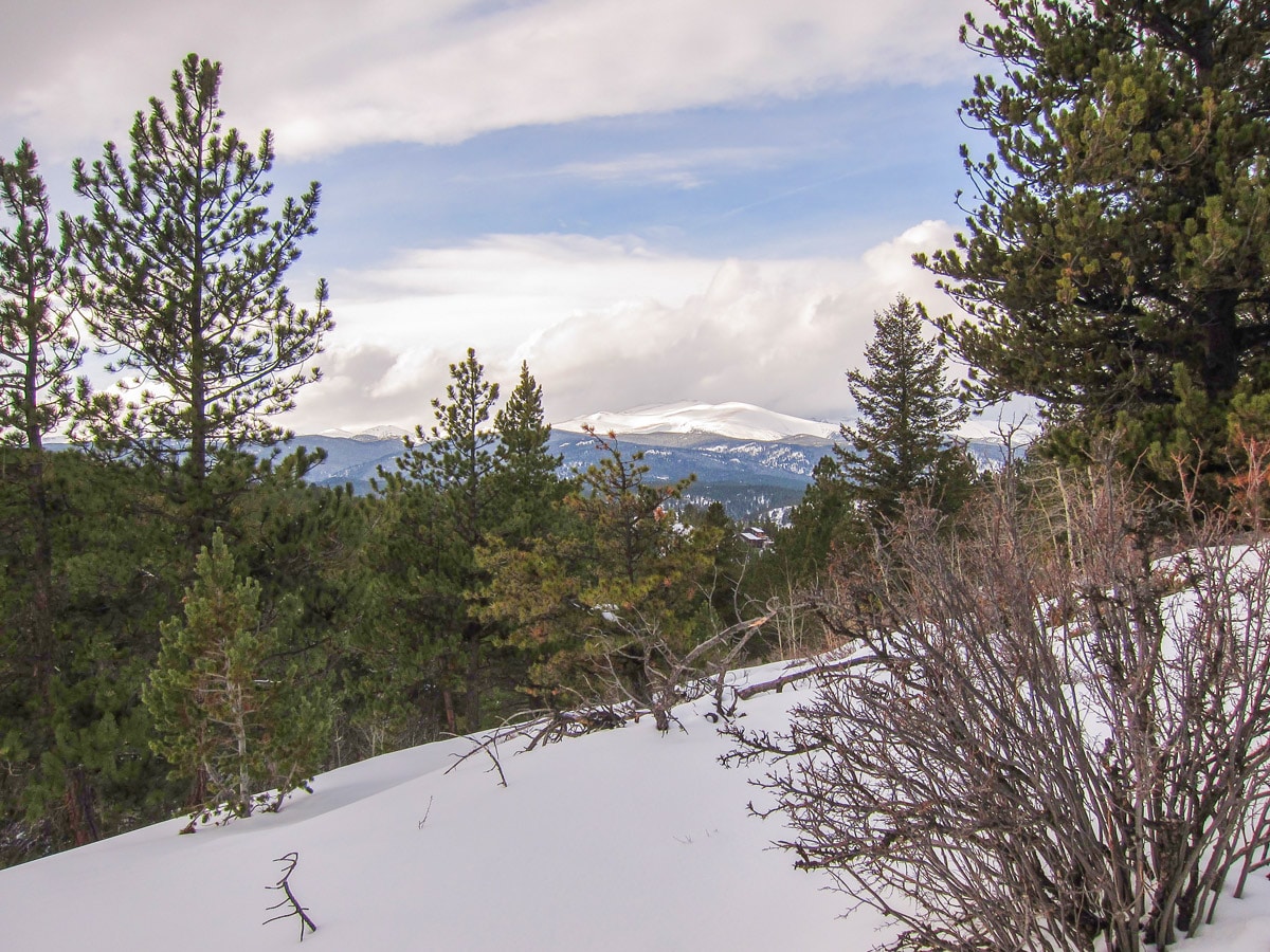 Hiking during winter on Dot snowshoe trail in Indian Peaks, Colorado