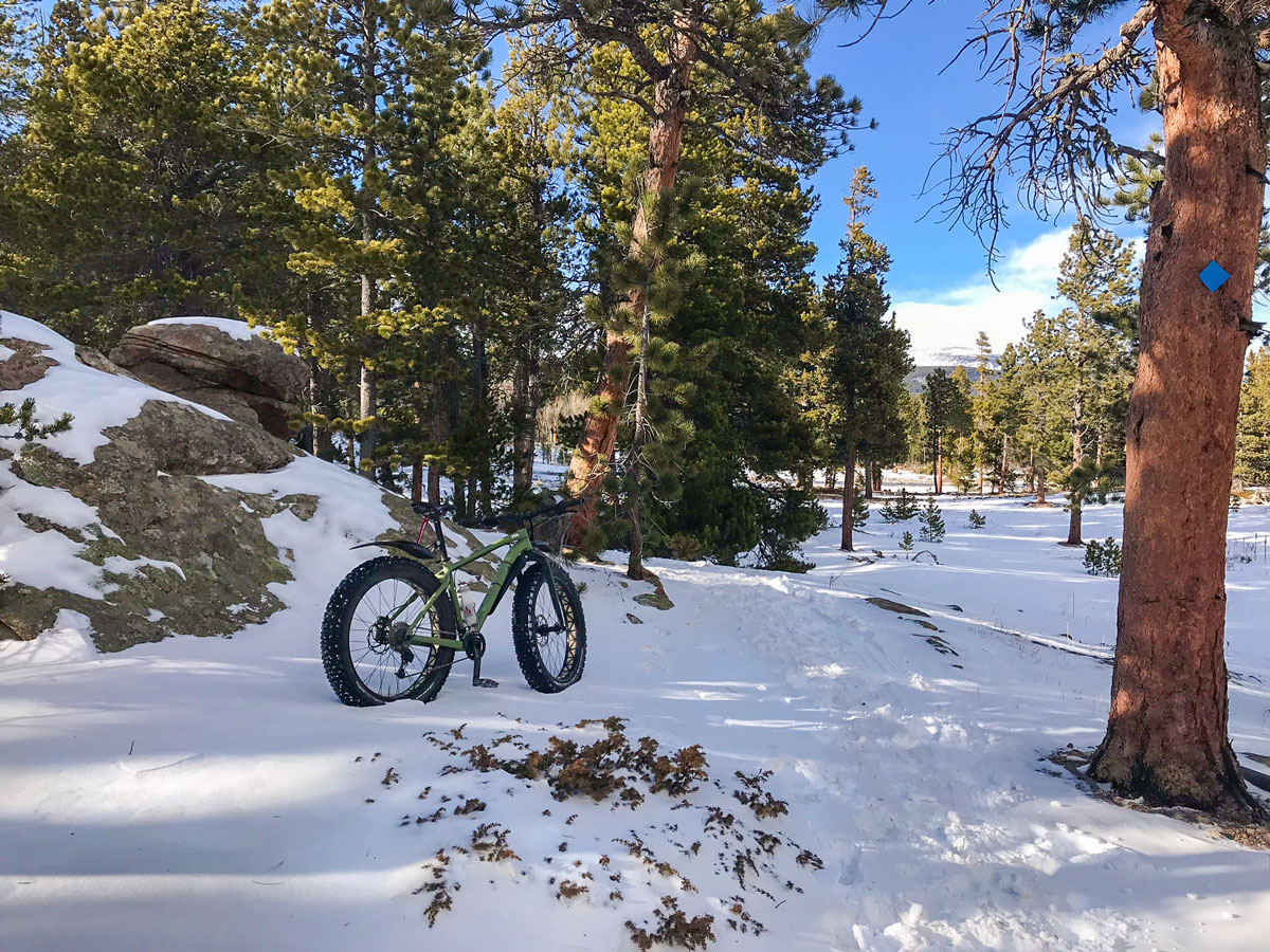 Fat tire bike on Mud Lake snowshoe trail in Indian Peaks, Colorado