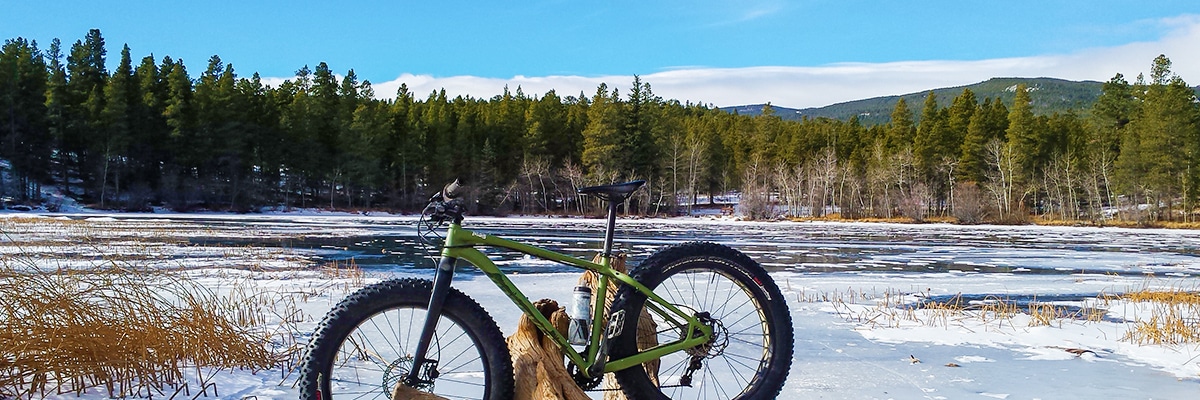 Biker on Mud Lake snowshoe trail in Indian Peaks, Colorado