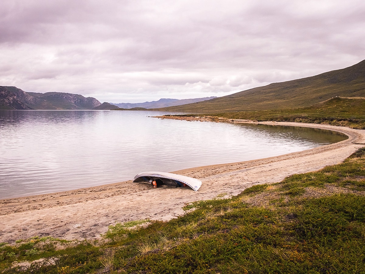 Canoe on shore of the lake Amitsorsuaq on Greenland’s Arctic circle trail