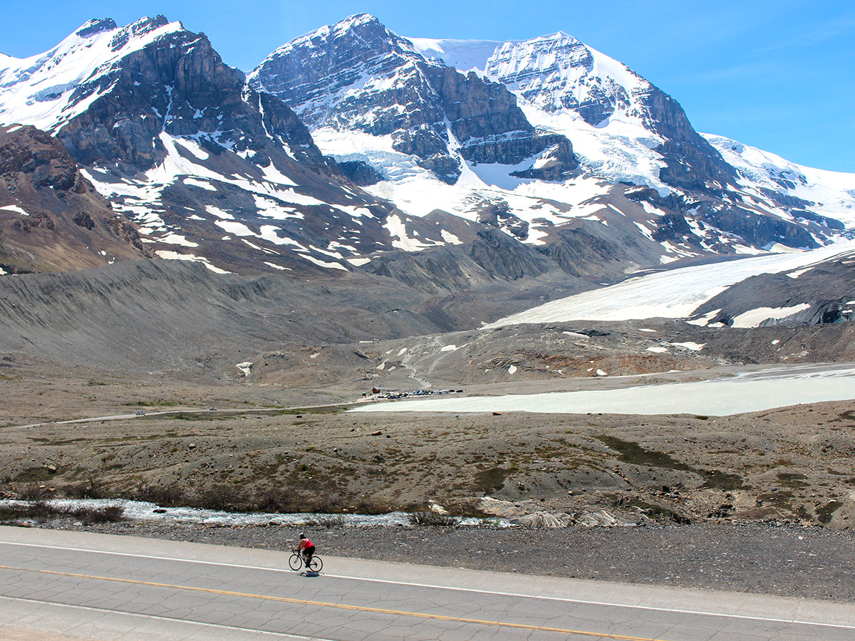 Cycling by the Athabasca Glacier on Jasper to Banff road biking route