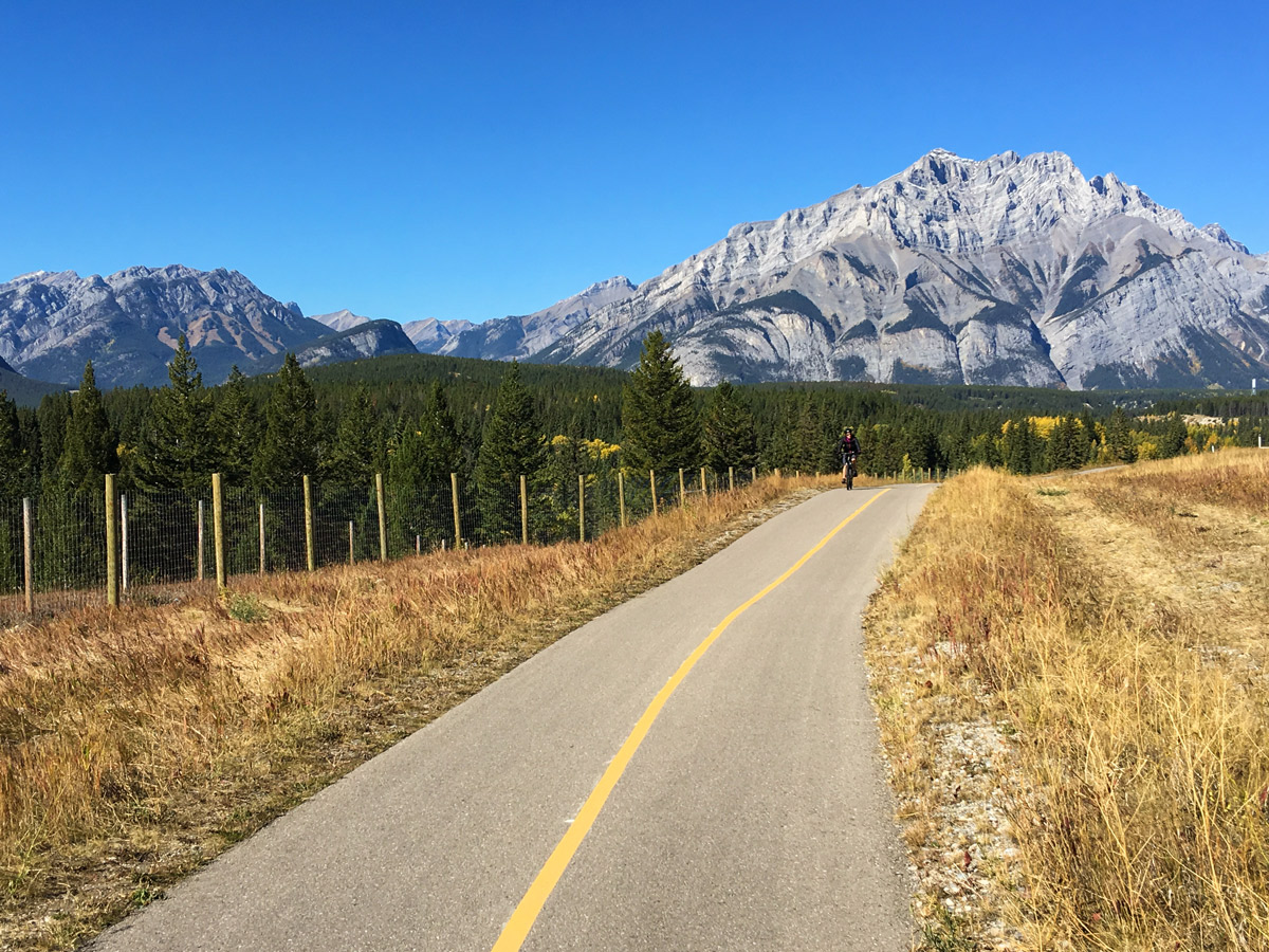 Cycling on a sunny day on Legacy Trail from Canmore to Banff road biking route in the Canadian Rockies