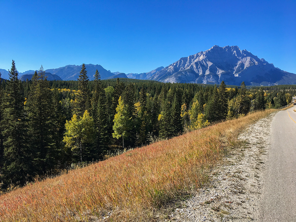 Autumn cycling on Legacy Trail from Canmore to Banff road biking route in the Canadian Rockies
