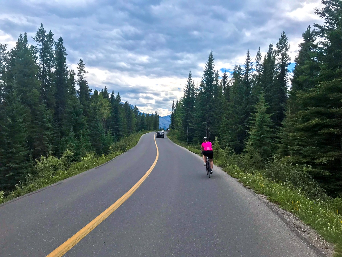 Fun downhill ride on Minnewanka Loop road biking route in Banff National Park