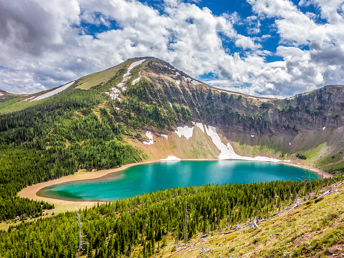 Approaching Bovin Lake on Drywood Mountain Traverse scramble in Castle Provincial Park, Alberta