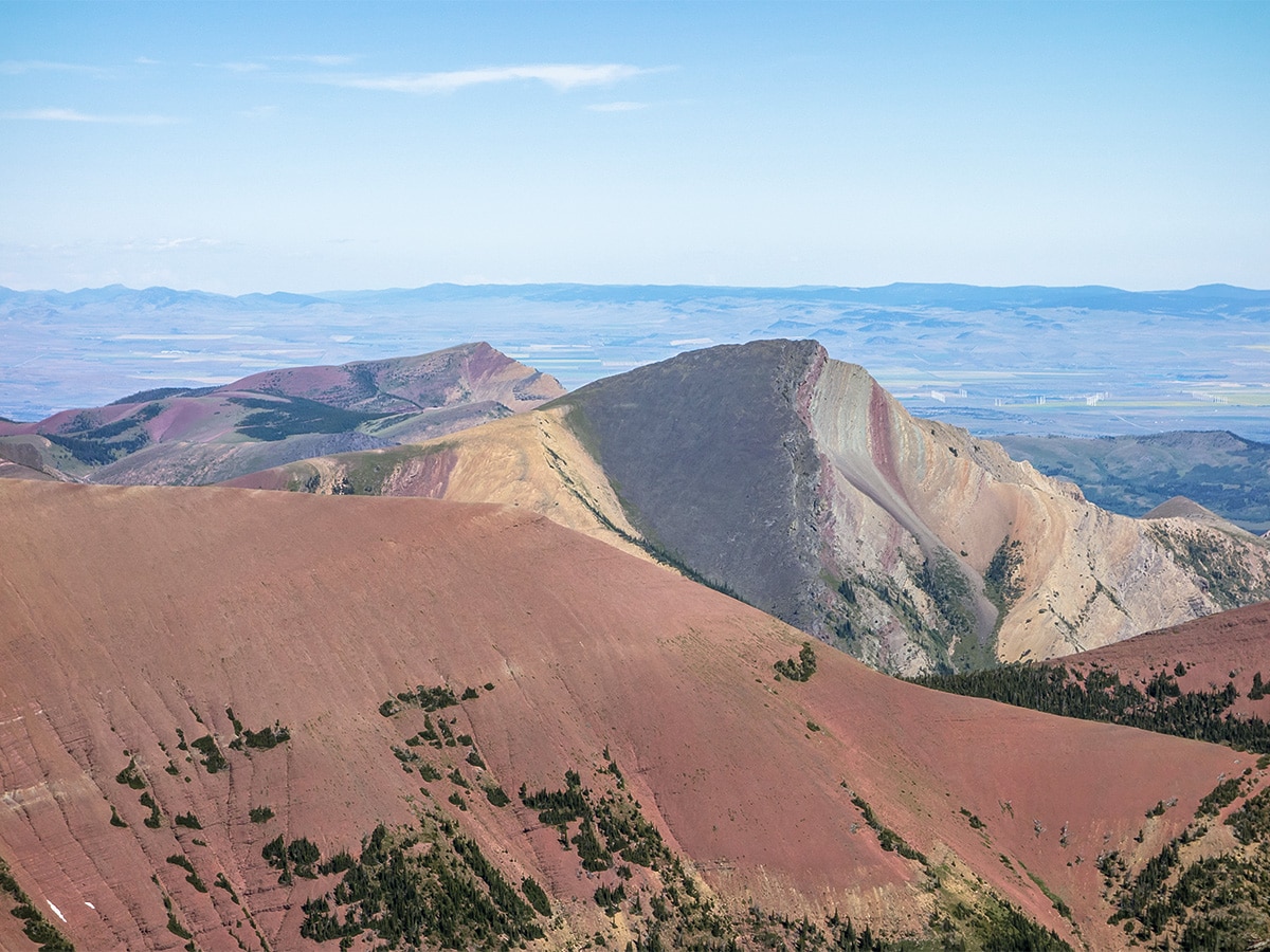 Deep reds of the mountains on Loaf Mountain and Spionkop scramble in Castle Provincial Park, Alberta