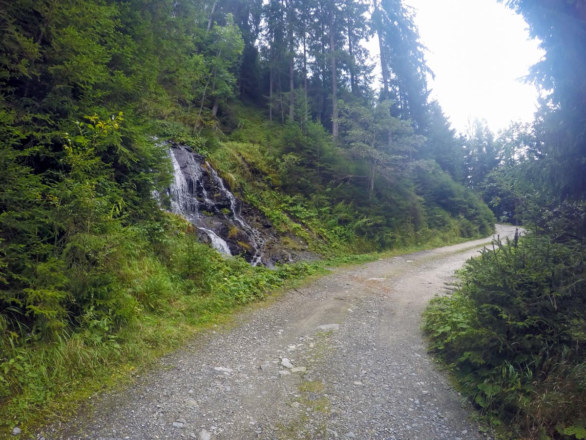 Following the wide road on Hamberg hike near Mayrhofen, Zillertal Valley, Austria