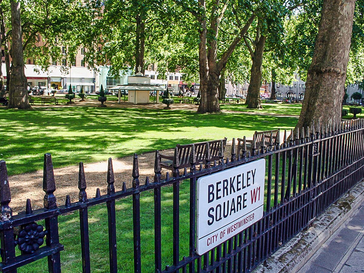 Relaxing Berkeley Square in Mayfair while on city-walk in London, England, UK