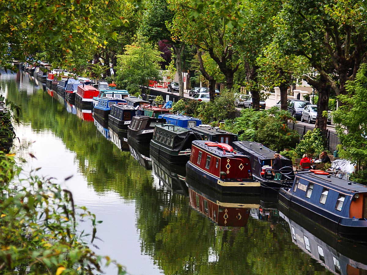 Houseboats along the canal on Regent's Canal from Edgware Road to Camden Town walking tour in London, England