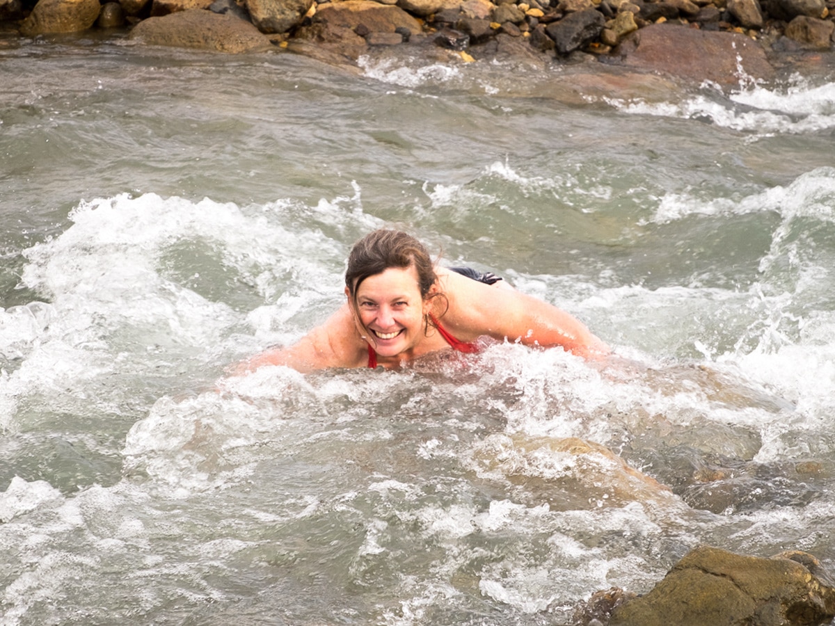 Bathing in the glacial river on a trek in Iceland