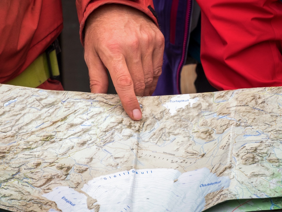 Lisa Germany using the paper map on a trek