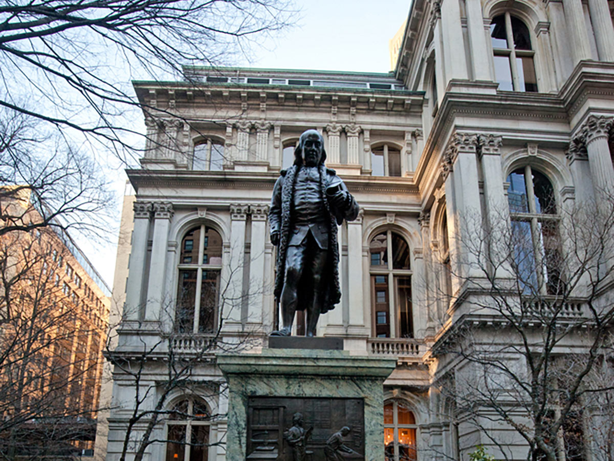 Old Town Hall with Benjamin Franklin statue on Freedom Trail city walk in Boston, Massachusetts
