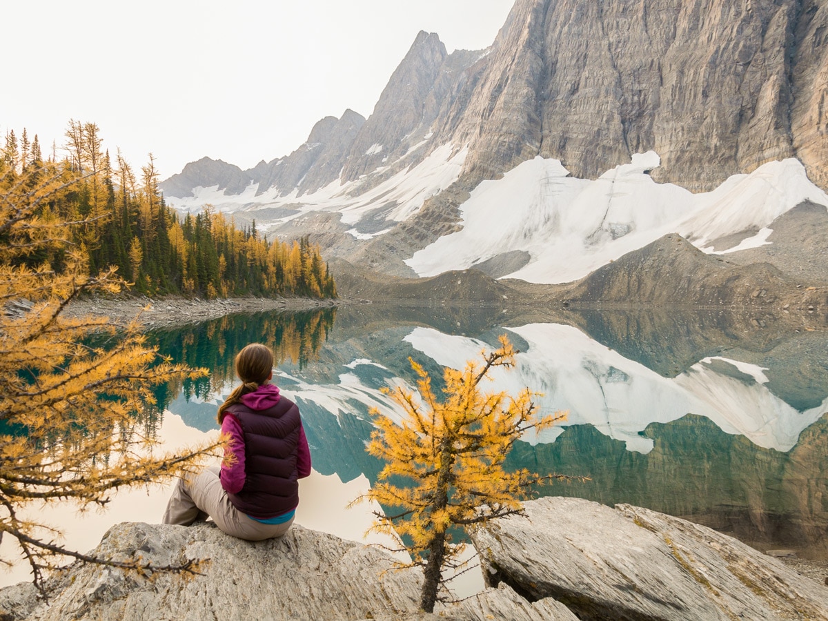 Hiker near the lake on Floe Lake and Numa Pass backpacking trail in Kootenays National Park