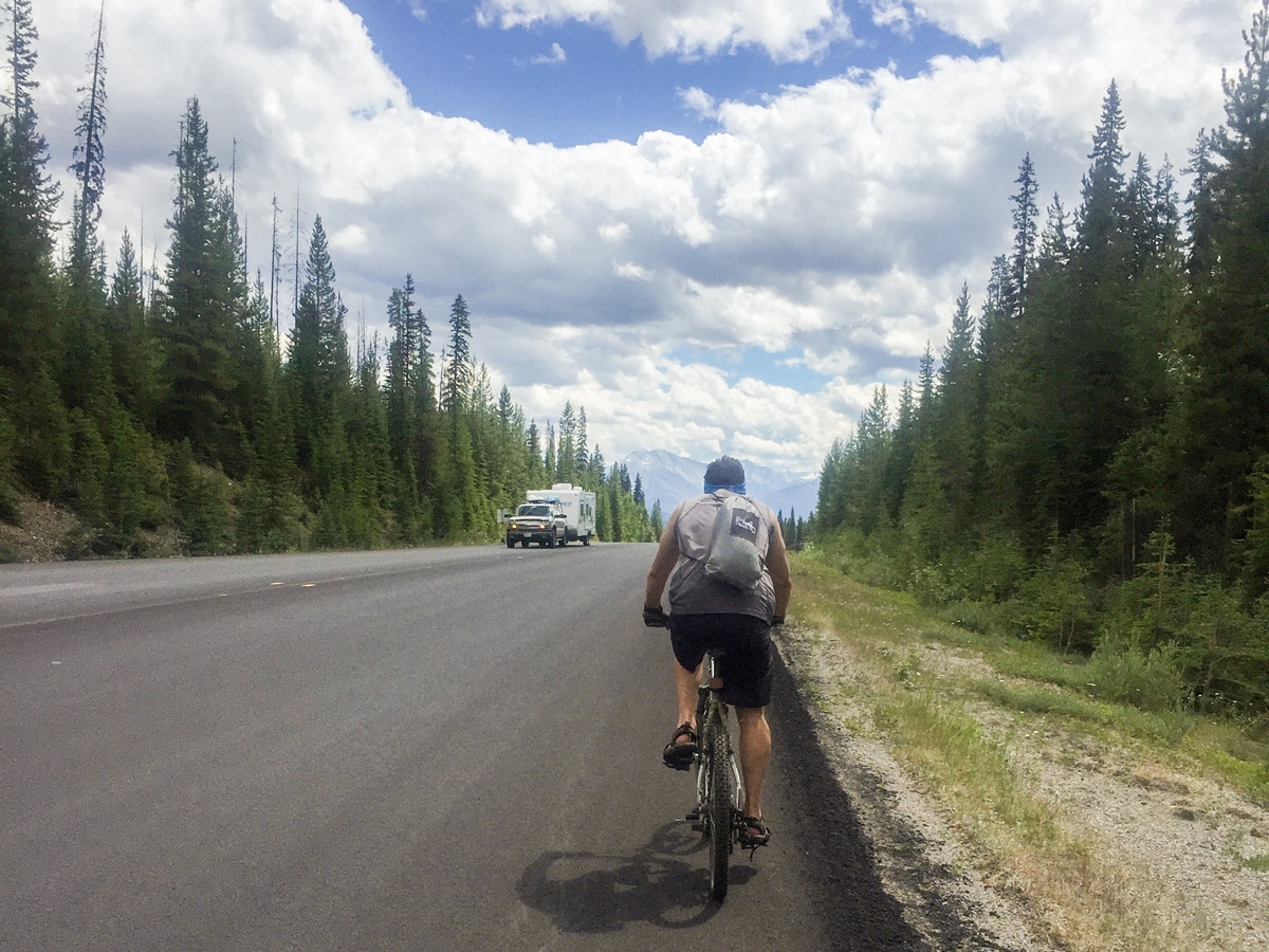 Biker on road near Rockwall backpacking trail in Kootenays National Park
