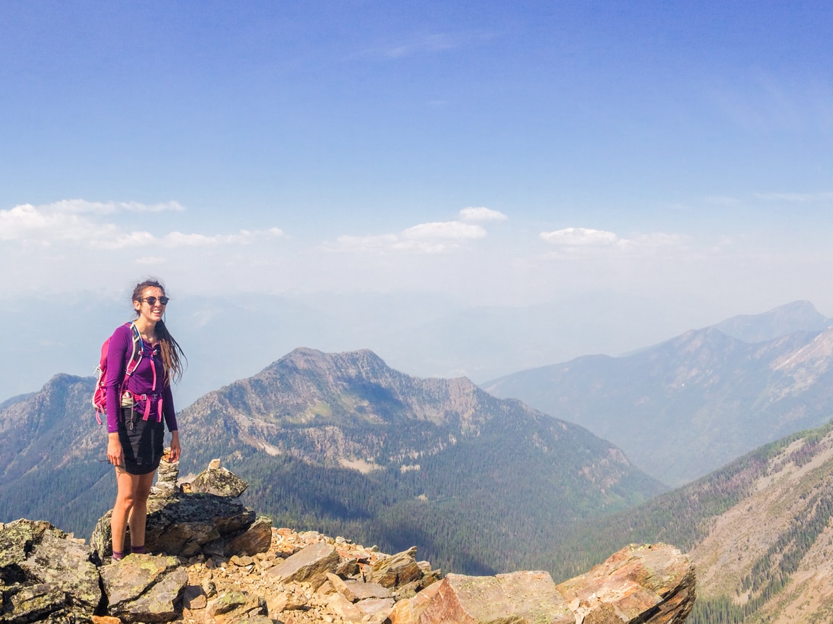 Hiker on top of Mount Loki hike in West Kootenays