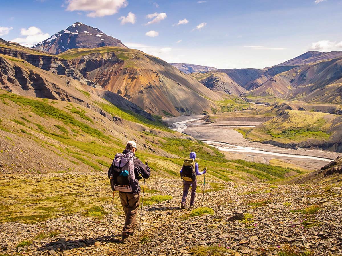 Hikers approaching the river on Iceland’s Shadow of Vatnajökull Trek