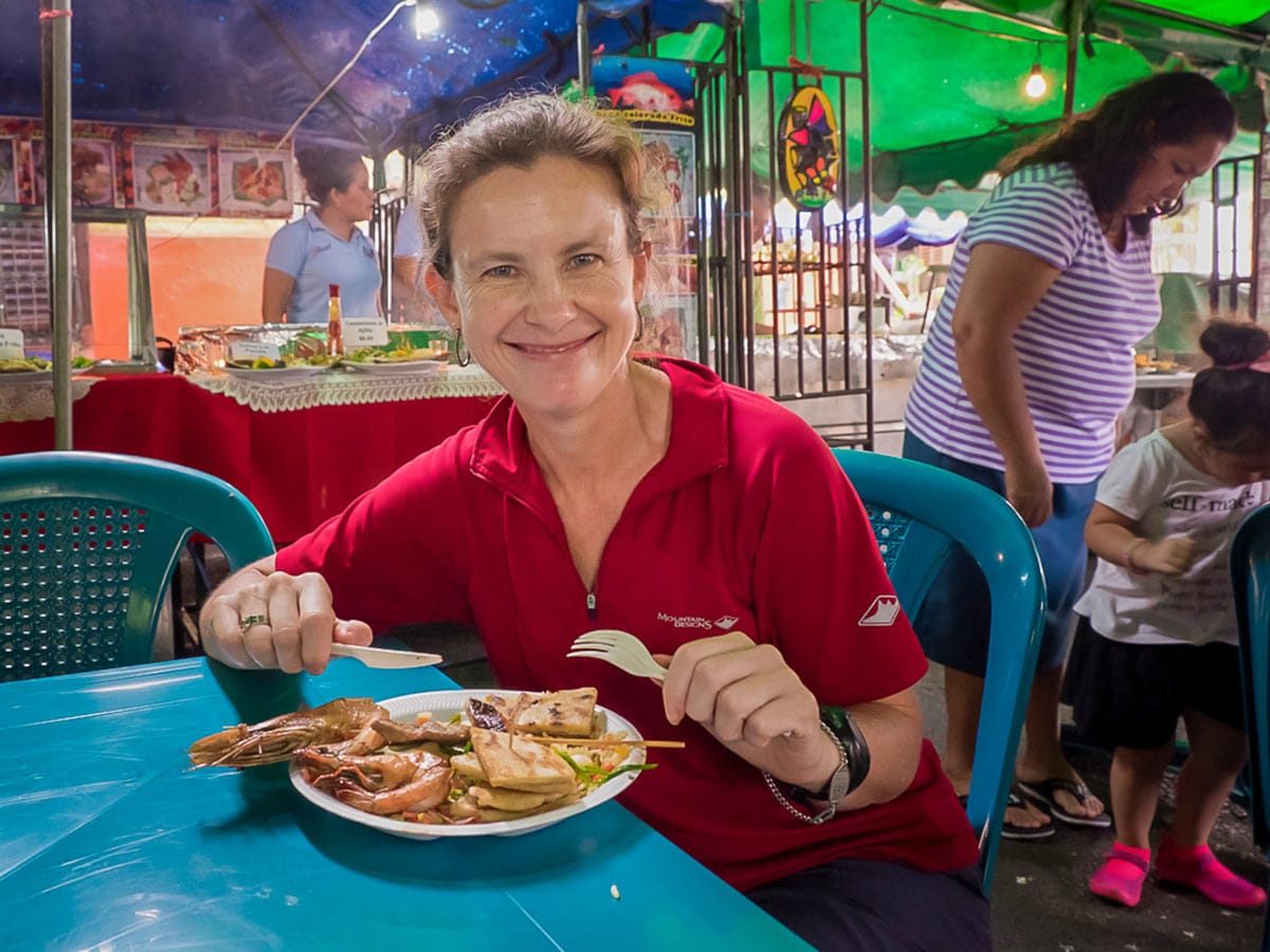 Shopping at market for a local dish helps to save money to afford traveling full-time