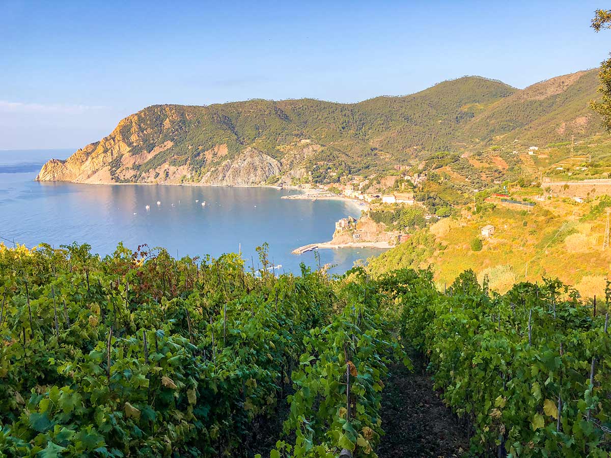 Small bay and beautiful Italian villages along the coast of Cinque Terre hike in Liguria, Italy