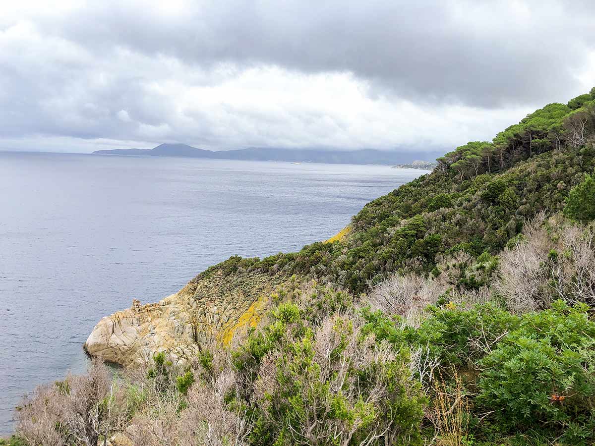 Rocky cliffs of Enfola Peninsula on a walk in Elba Island, Tuscany