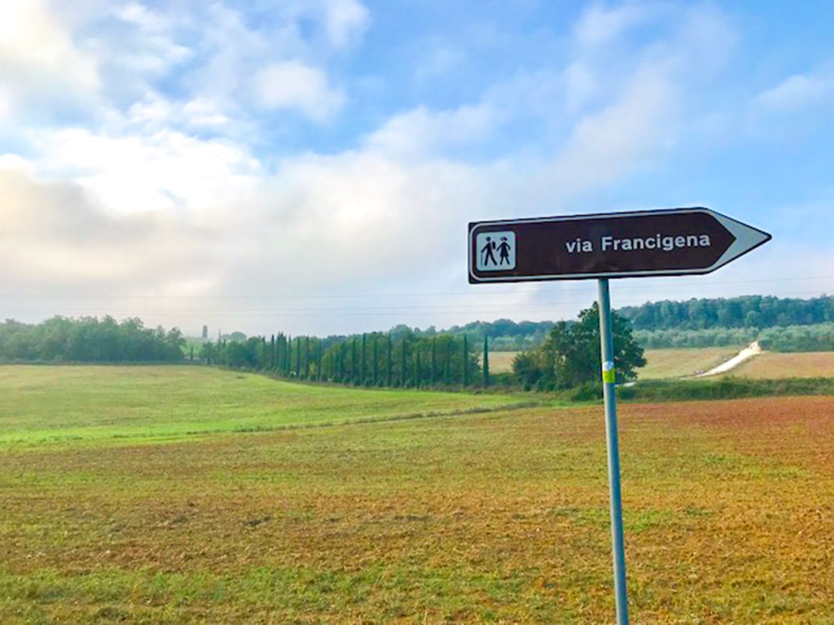 Signage of Monteriggioni to Piazza del Campo Siena Via Francigena Hike in Tuscany, Italy