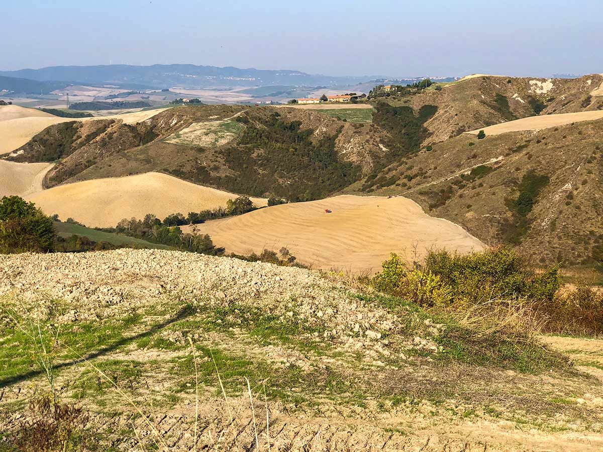 Beautiful farmlands along the trail of Volterra Loop Hike in Tuscany
