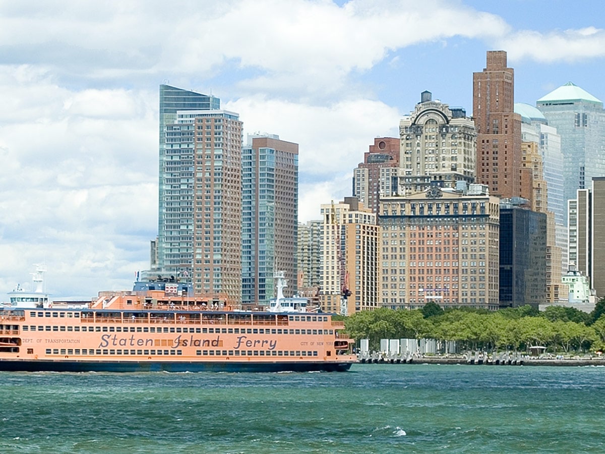 Staten Island Ferry in front of Battery Park on Brooklyn Bridge, Wall Street, Statue of Liberty Walking Tour in New York City