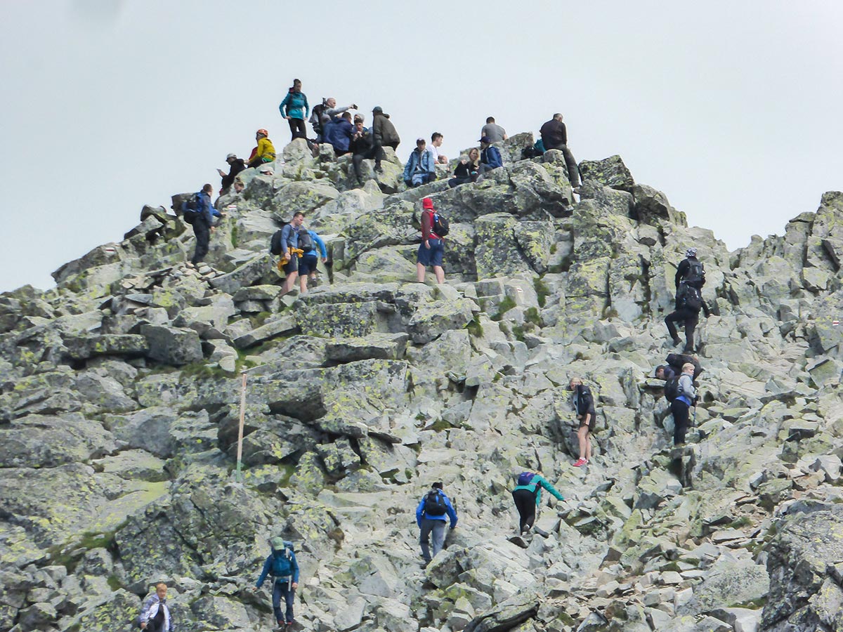 Hikers on top of mount Rysy