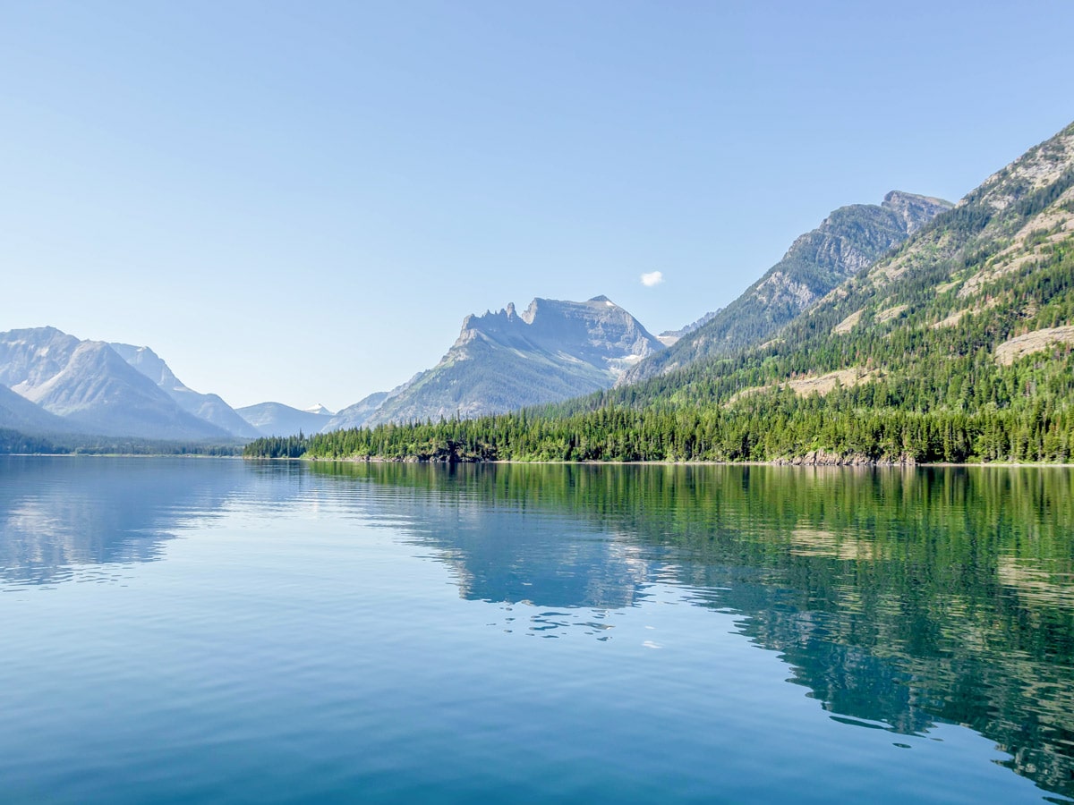 Beautiful views from crossing Upper Waterton Lake before the start of Boulder Pass Backpacking Trail in Glacier National Park