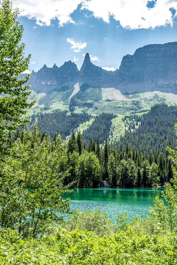 Sharp peaks and beautiful lake on Boulder Pass Backpacking Trail in Glacier National Park