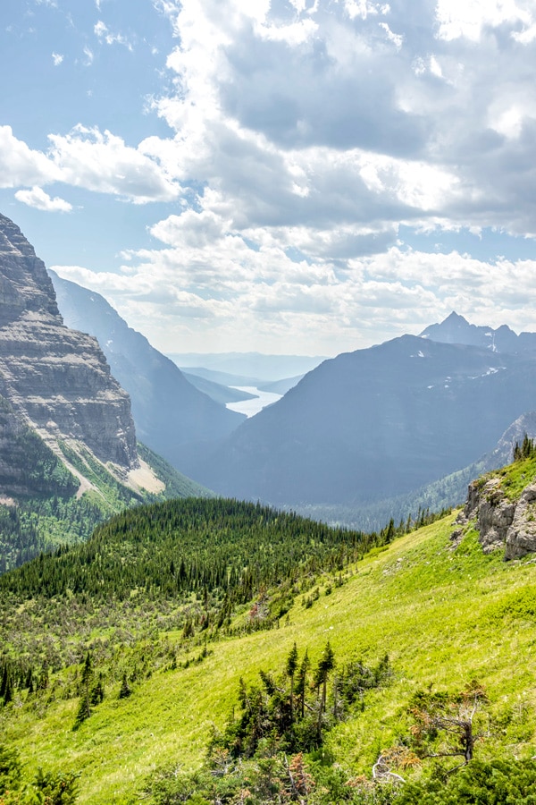 Beautiful Montana mountains and lake in the distance on Boulder Pass Backpacking Trail in Glacier National Park