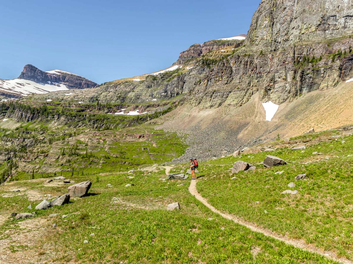 Happy backpacker on Boulder Pass Backpacking Trail in Glacier National Park