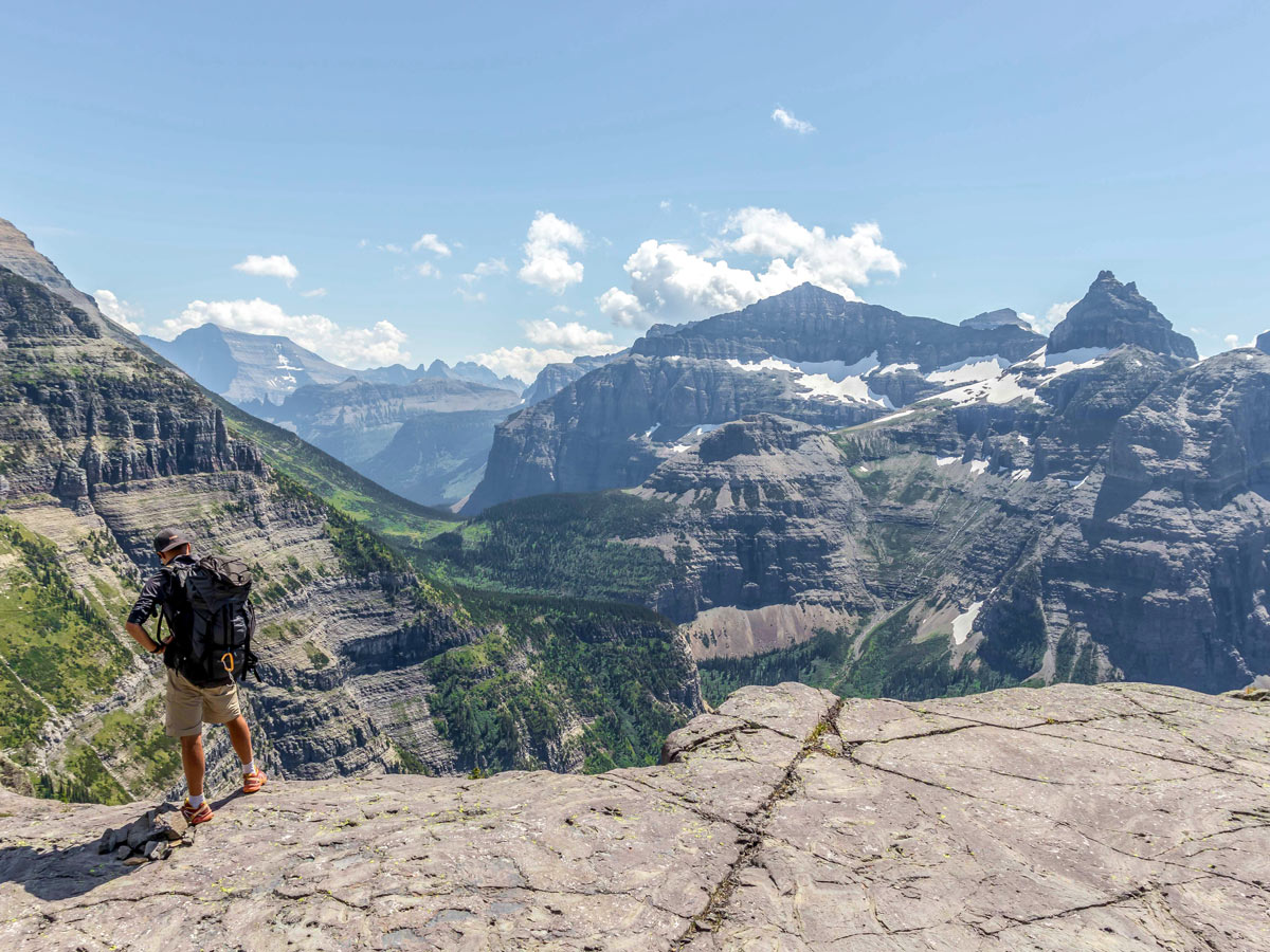 Hiker at amazing overlook on Boulder Pass Backpacking Trail in Glacier National Park