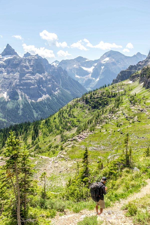 Backpacker hiking on Boulder Pass Backpacking Trail in Glacier National Park