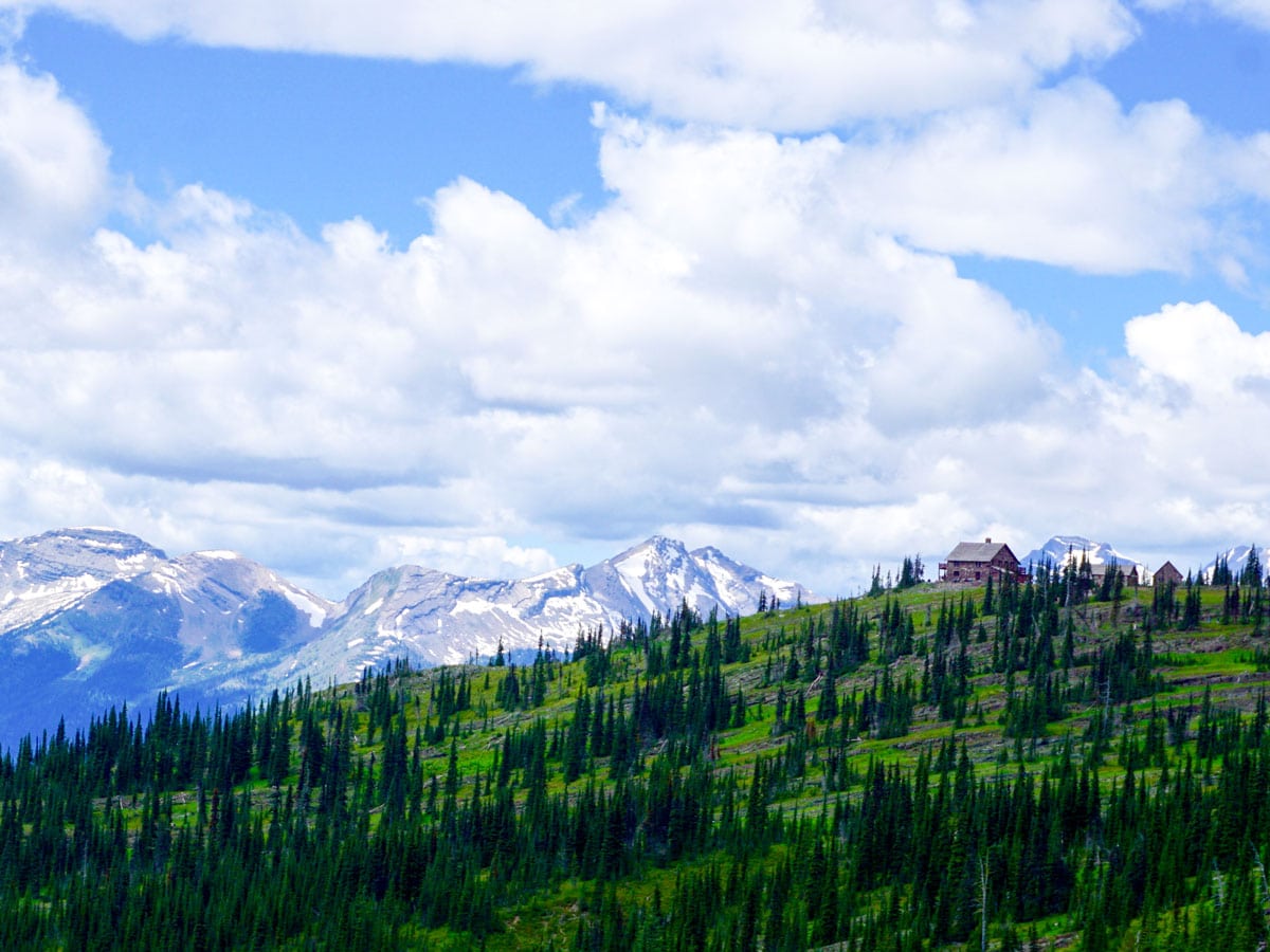 Granite Park Chalet surrounded by mountains on Highline backpacking trail in Glacier National Park, Montana